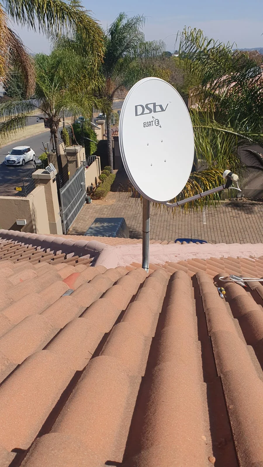 Installed DStv satellite dish on tiled roof